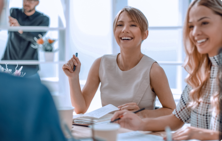 young-business-woman-sitting-office-desk555 1